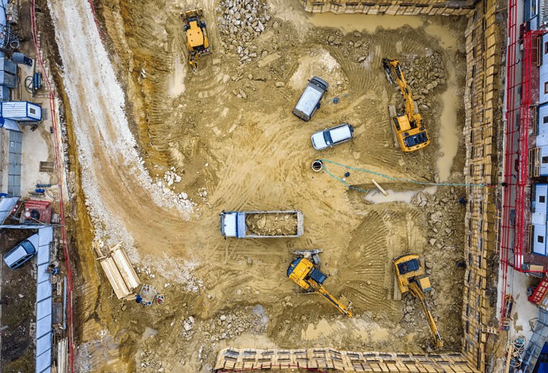 An aerial view of a construction site, showcasing the need for efficient water management solutions like static water bowsers for dust suppression, concrete mixing and cleaning.