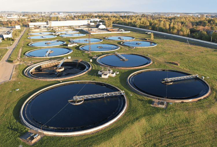 An industrial wastewater treatment plant with multiple clarification tanks designed for efficient effluent wastewater treatment through appropriate tank design and operation.
