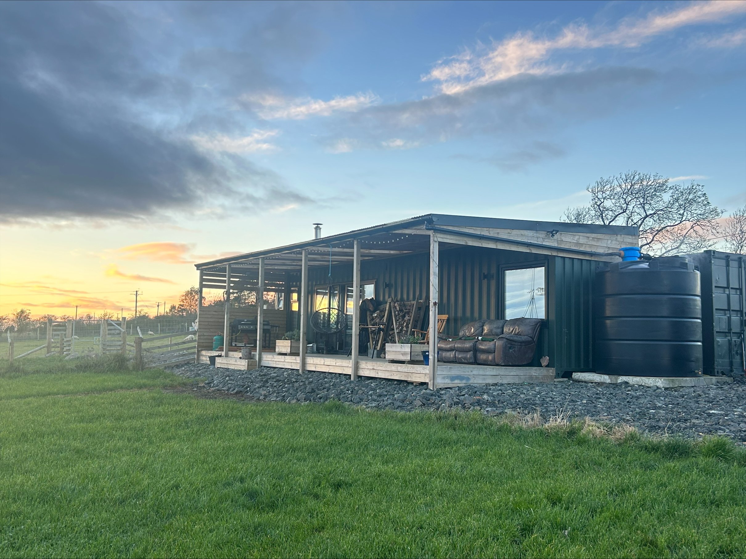 Enduramaxx Rainwater harvesting kit outside an off-grid house