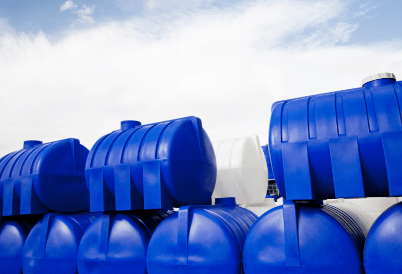 Industrial size water tanks being used to store water for a large project.